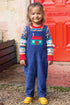 Cord-Latzhose von Frugi mit Haus-Motiv